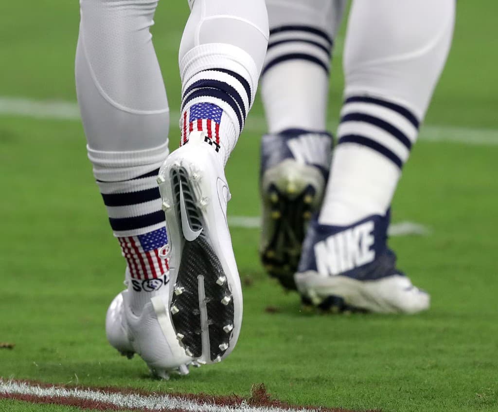Devin McCourty wearing Soleimpact United We Stand Mid-Calf Crew socks in an NFL game, 2015–2016 season
